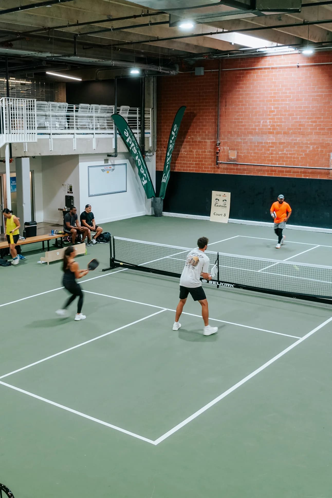 Aerial view of the 5 indoor courts at Sage & Paddle